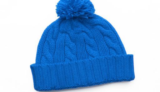 blue knit toque on white background