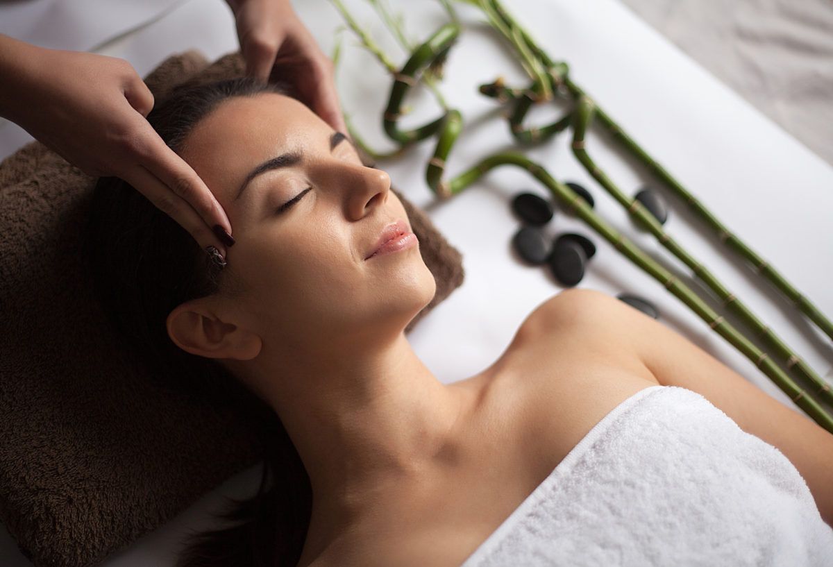Close-up of a women getting a face massage at a spa.