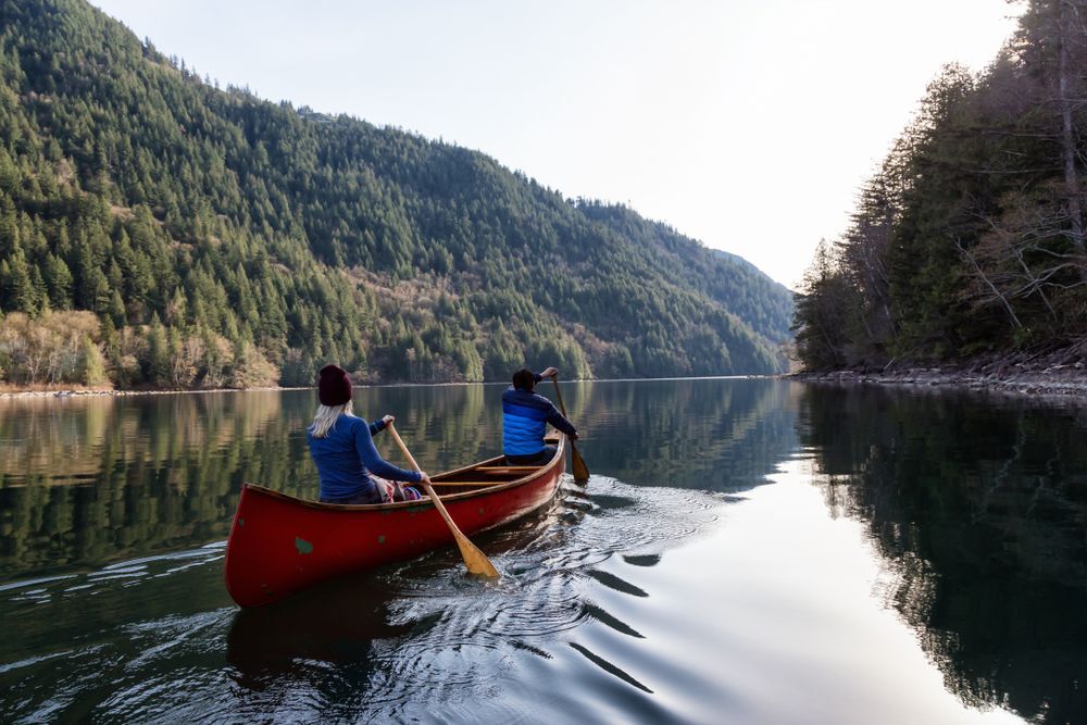 a-couple-canoeing-on-a-lake-in-british-columbia