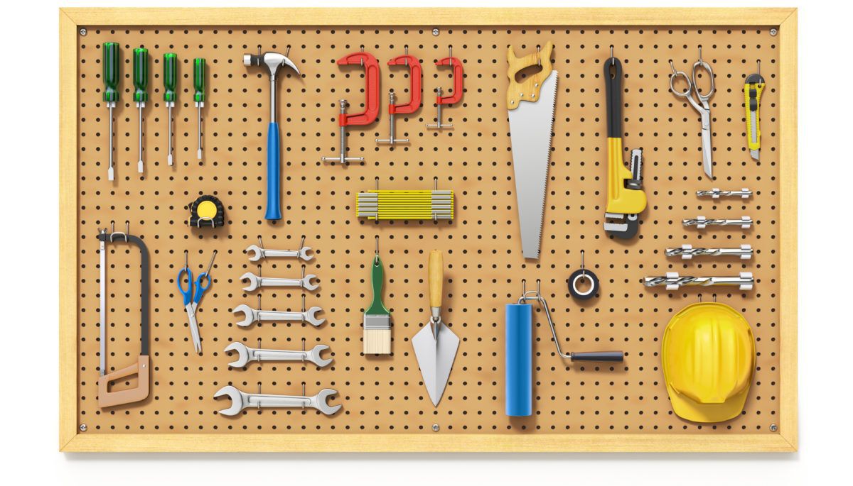 workshop pegboard with tools on it