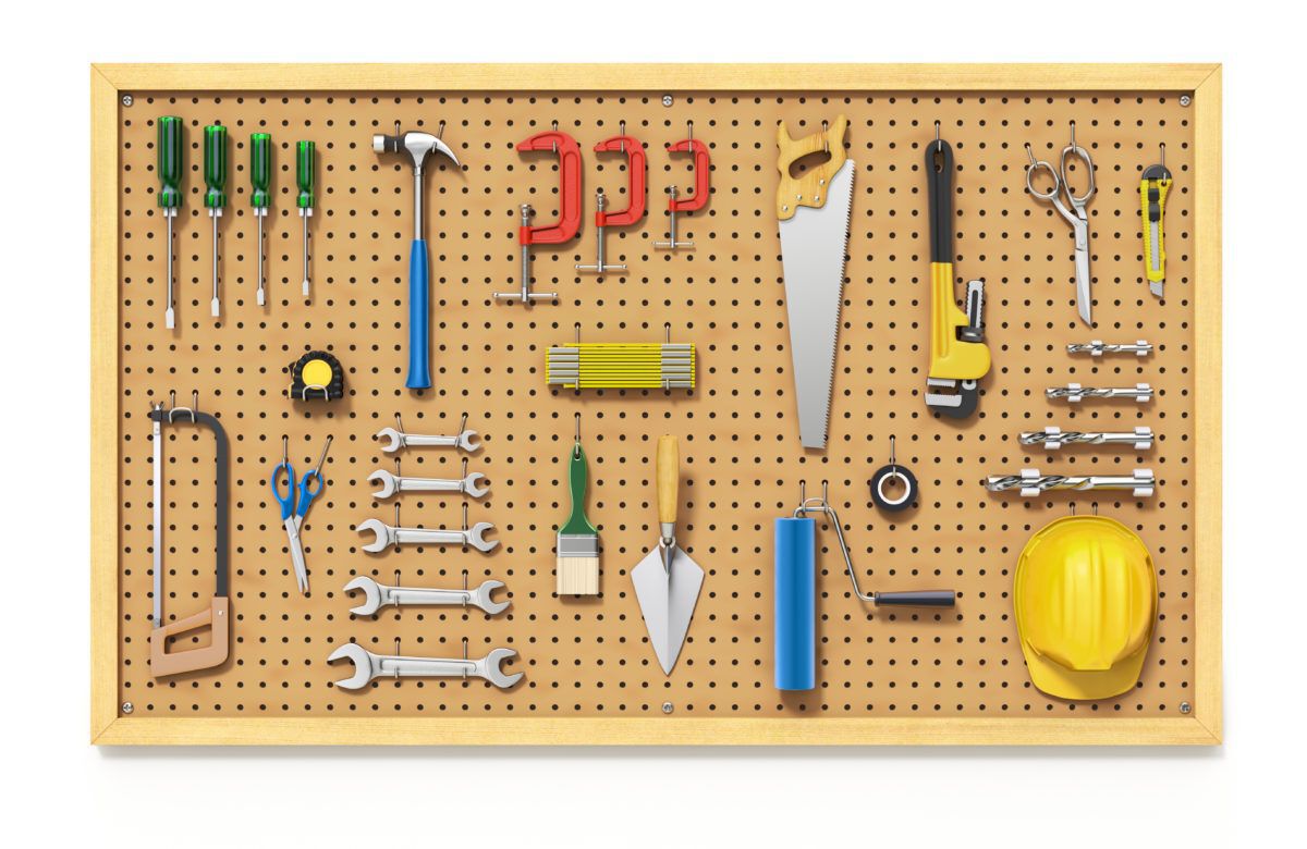 workshop pegboard with tools on it