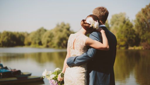 a-couple-having-their-wedding-by-the-lake-in-the-country