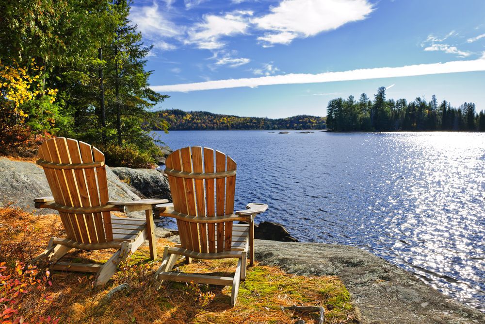 Adirondack chairs at shore of Lake of Two Rivers, Ontario, Canada