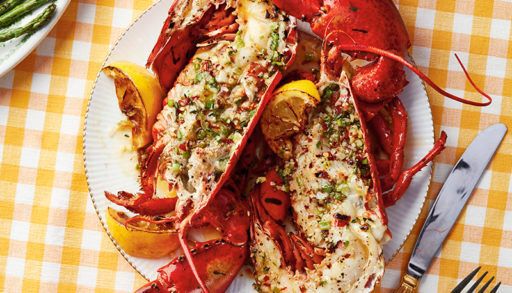 Wood-grilled lobster served on a plate on a yellow checkered table