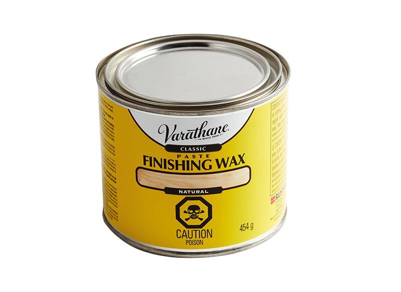 finishing wax to use on a stuck wooden drawer on white background