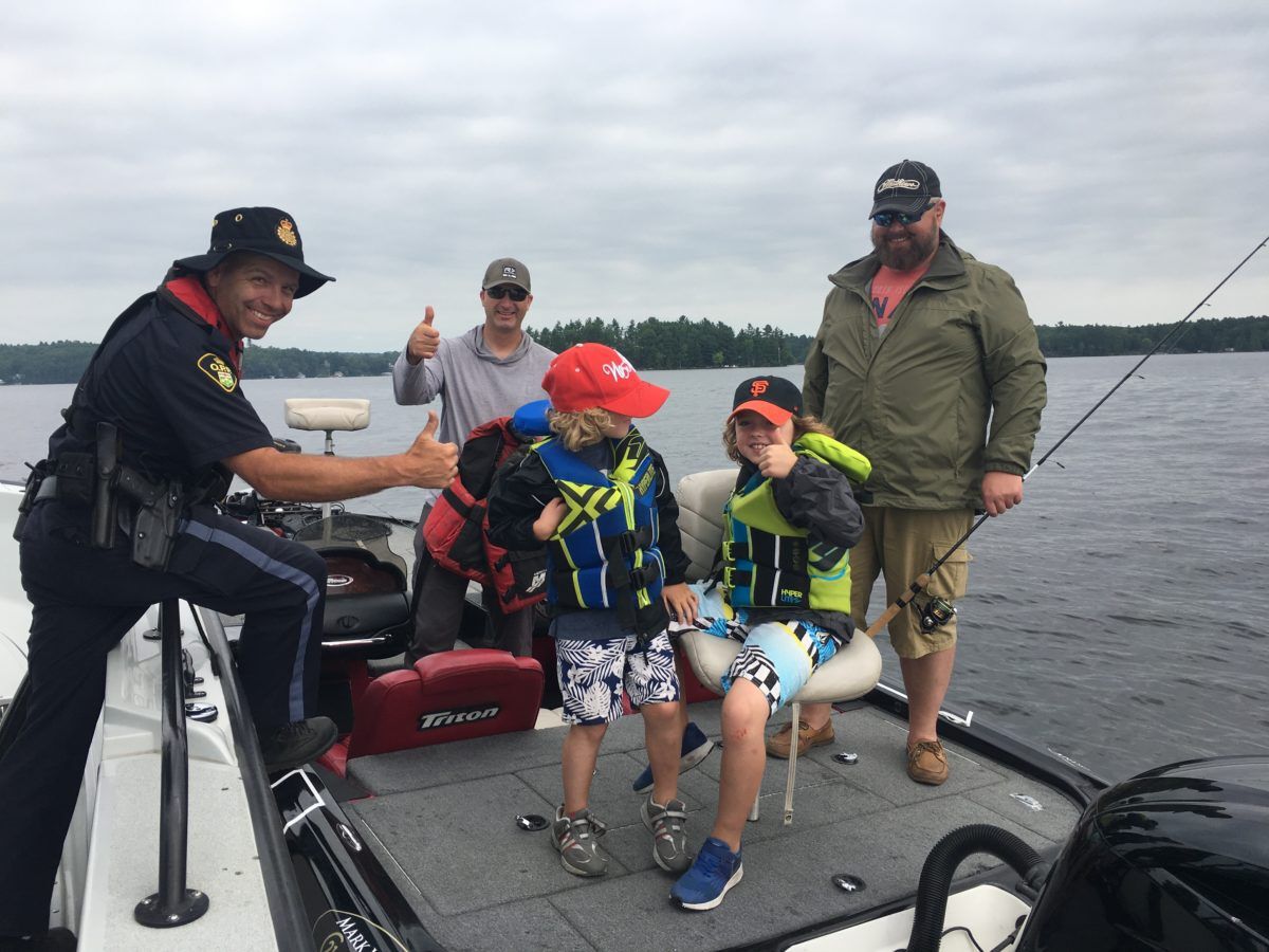 Cottagers after a successful boating courtesy check with OPP