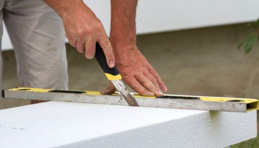 man-marking-tiles-for-laying-on-the-floor