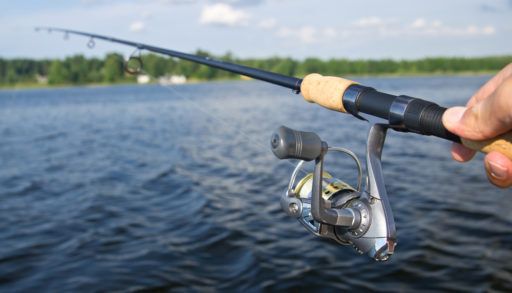 Fishing with rod on lake