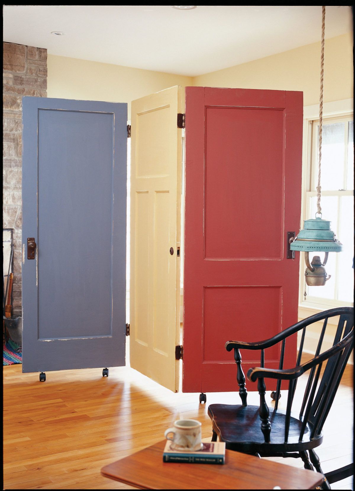 Three doors hinged together to create a privacy divider