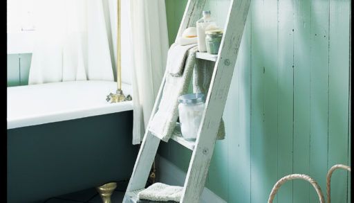 Ladder being used as shelves in bathroom