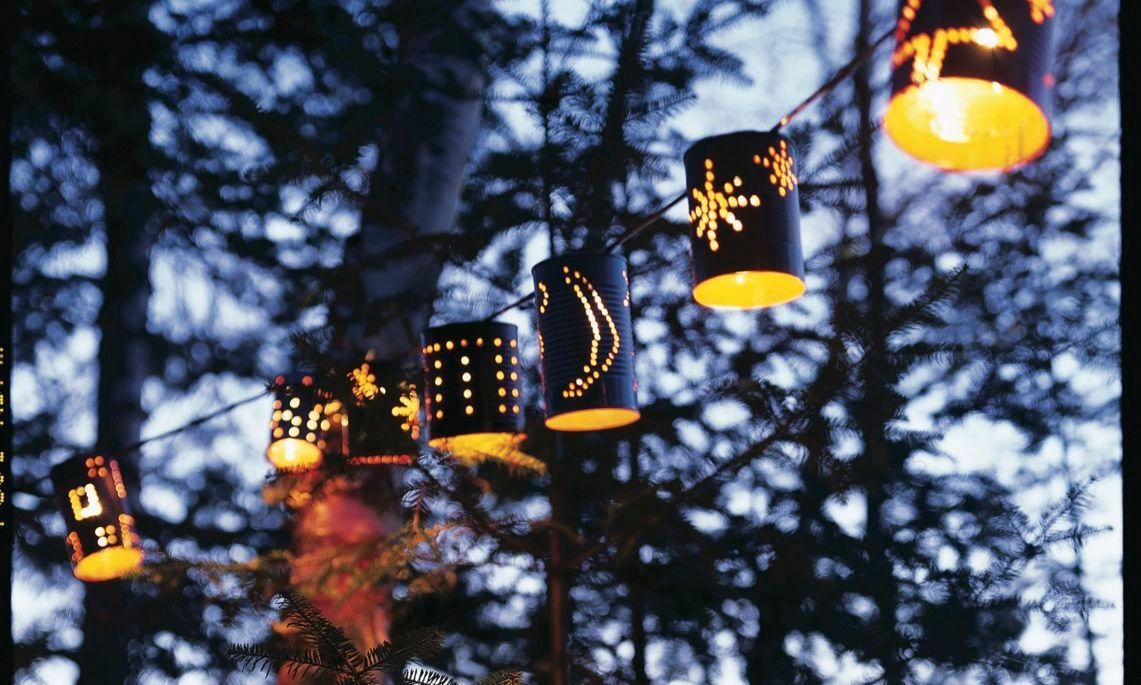 Tin can lanterns with designs on them