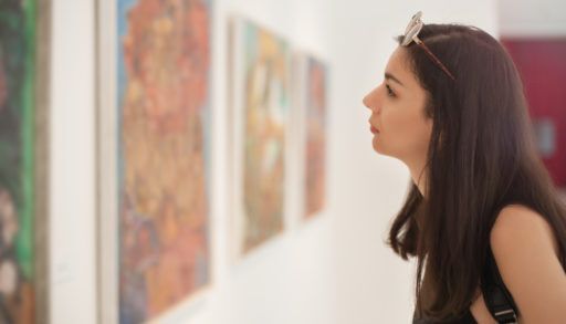 Woman looking at art in a gallery