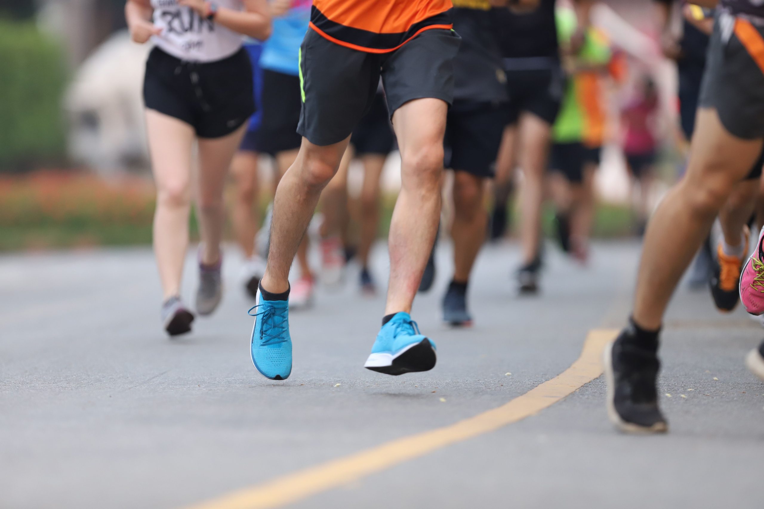Legs of people running in a marathon