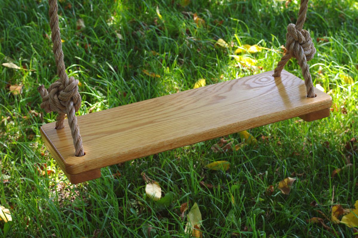 Seat of two-rope swing made from wood