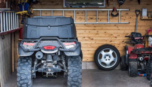 ATV quadbike parked at the garage after ride