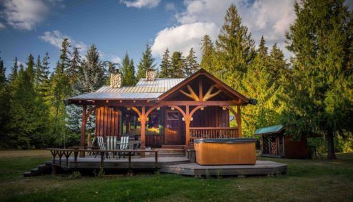 Front view of cabin in front of forest