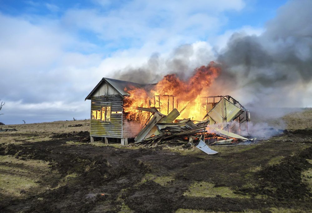 A cottage on fire.