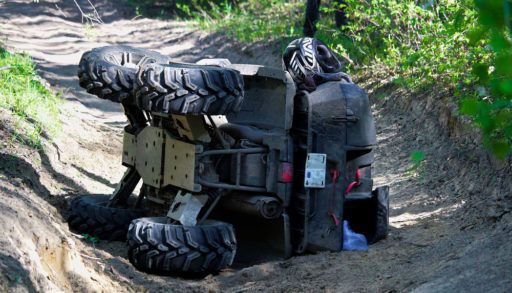 A quad on its side after ATV collisions
