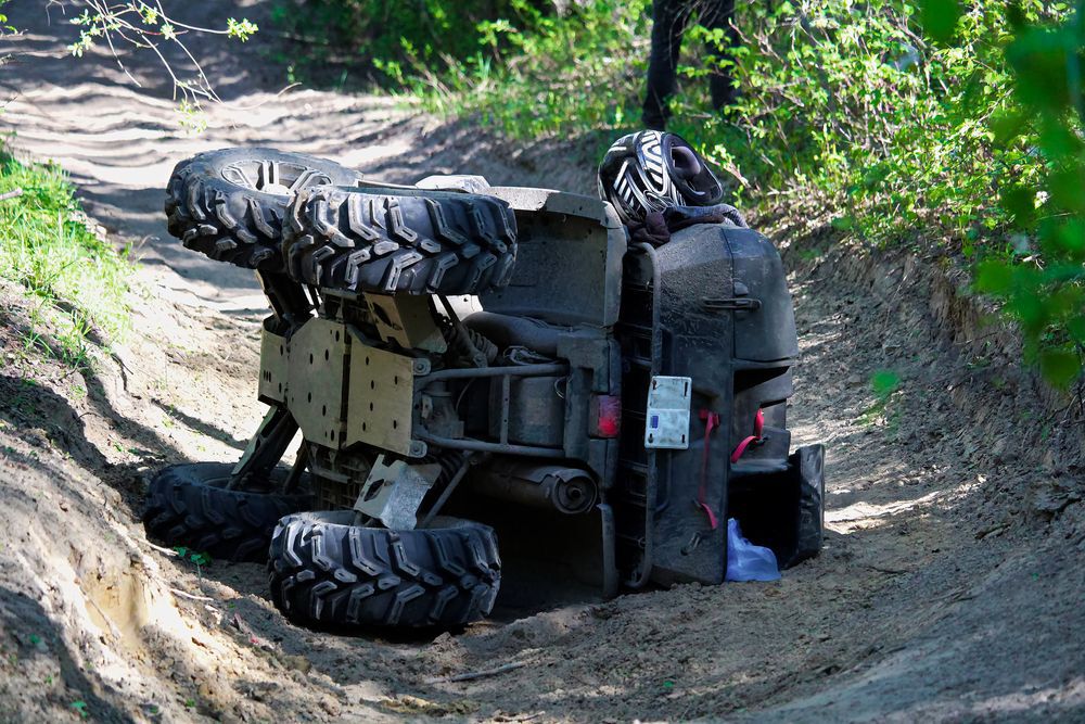 A quad on its side after ATV collisions