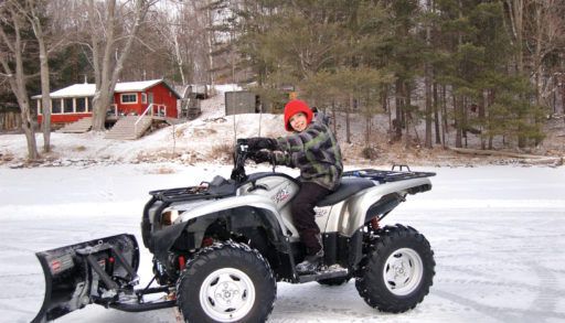 diy snow plow on atv with boy riding atv