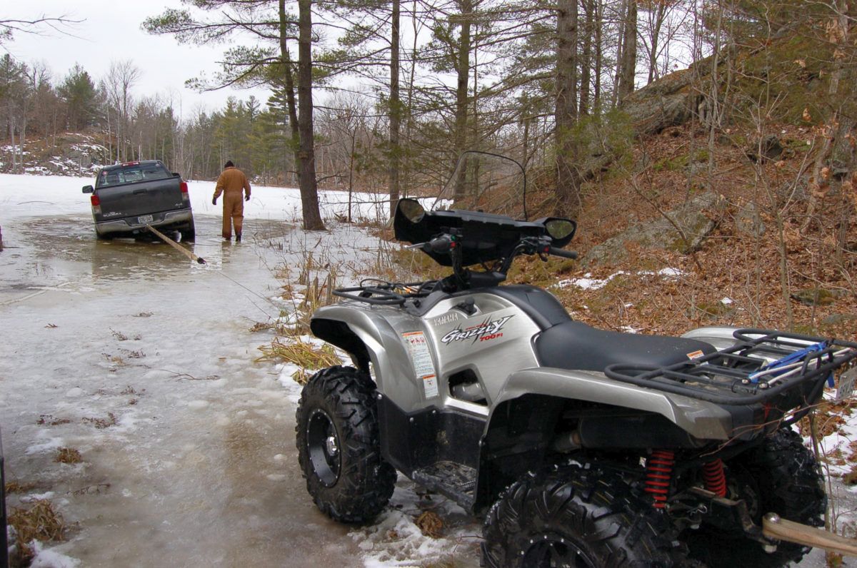 ATV towing truck out by a winch