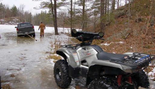 ATV towing truck out by a winch
