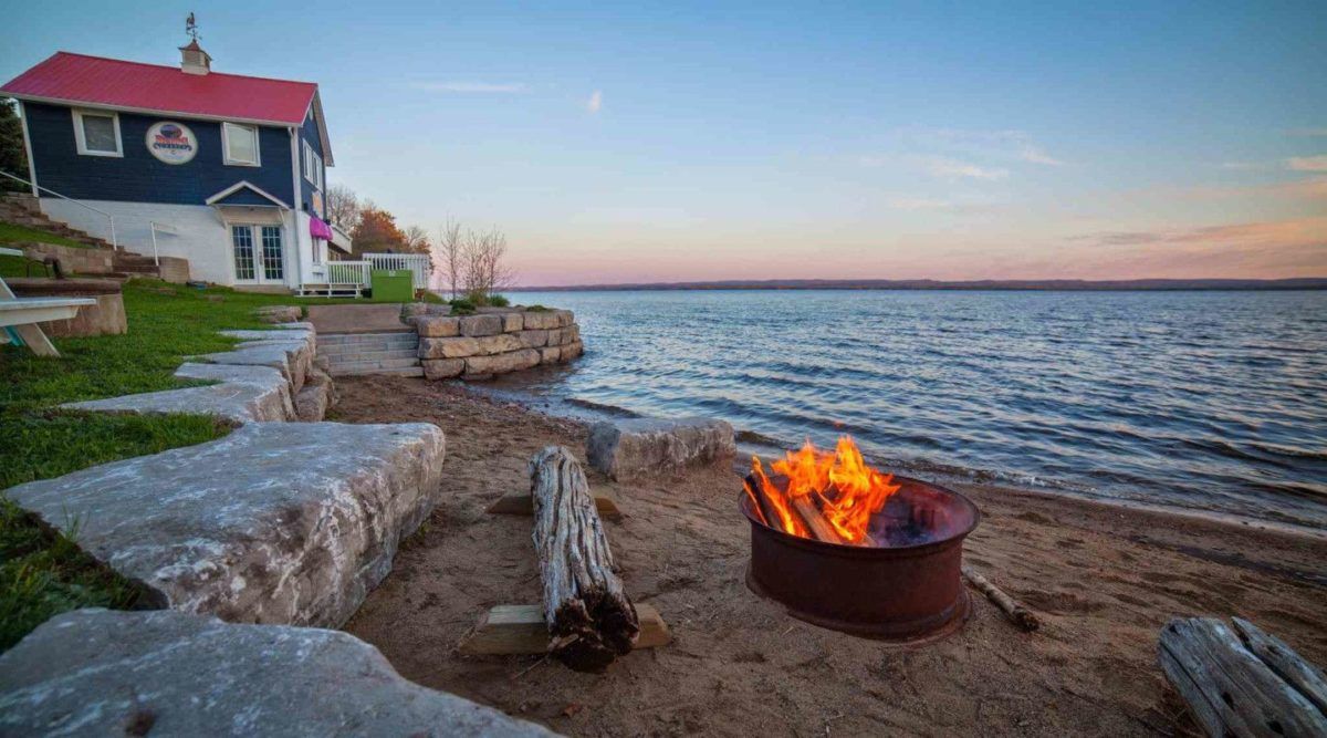 Cottage and fire pit on the beach