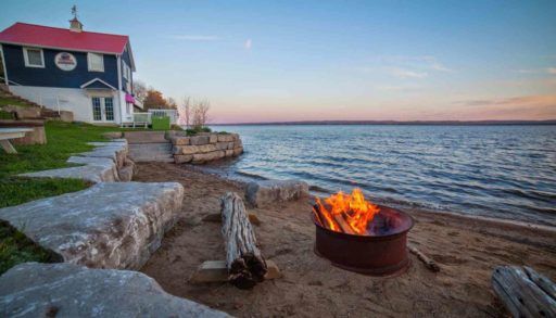 Cottage and fire pit on the beach