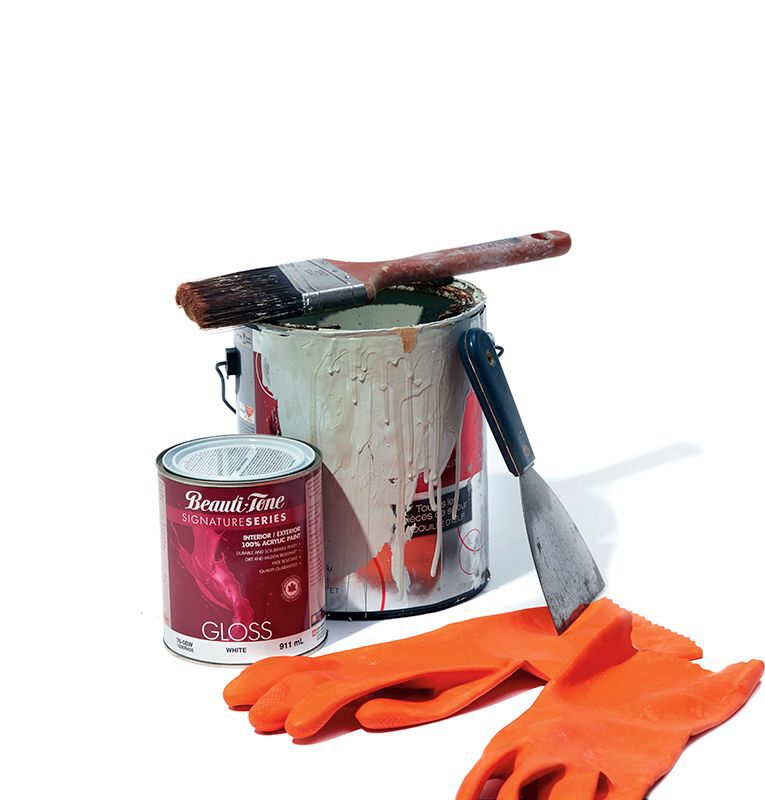 a paint can, rubber gloves, paintbrush, and scraper on a white background