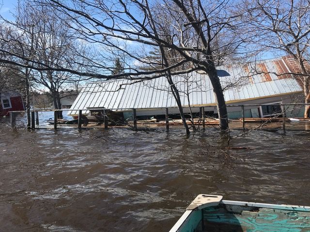 cottage partly submerged in flood