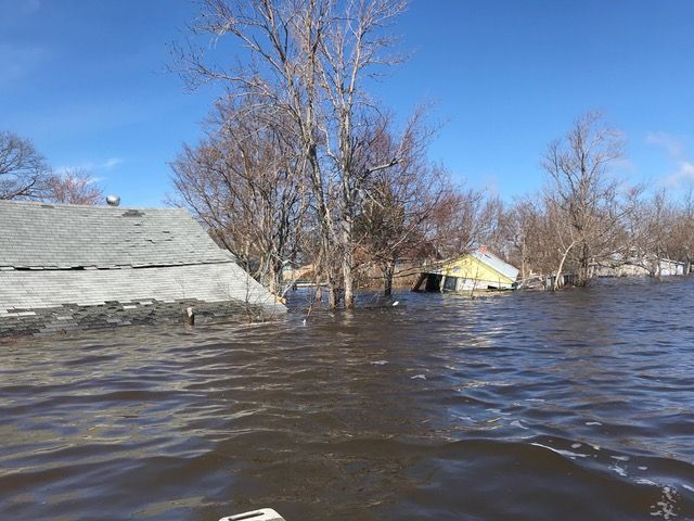 Cottage partly submerged in flood
