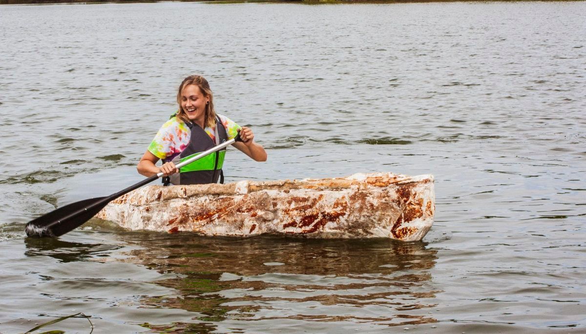 Girl in canoe made of fungi
