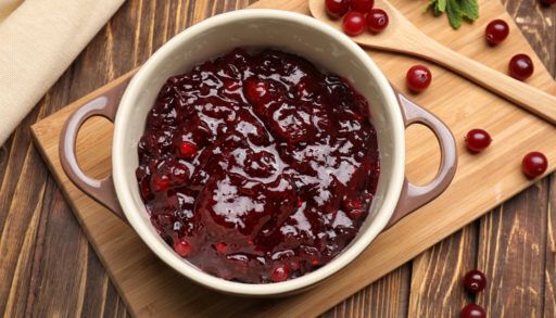 Cranberry sauce on wooden cutting board