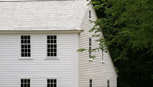 A house in New England featuring a saltbox roof.