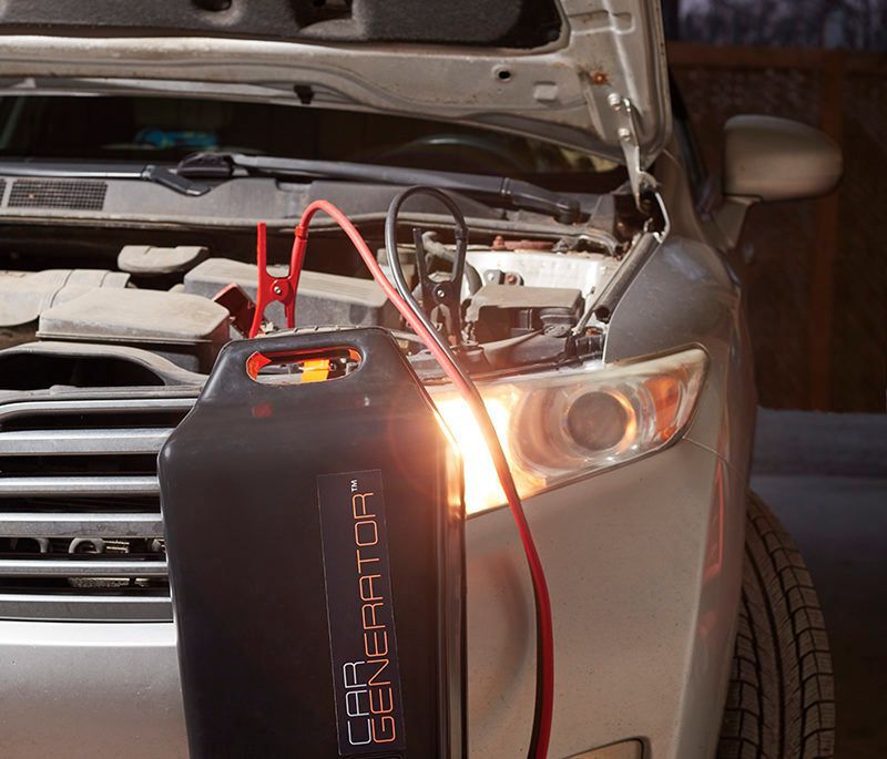 cargenerator hooked up to suv with its hood open