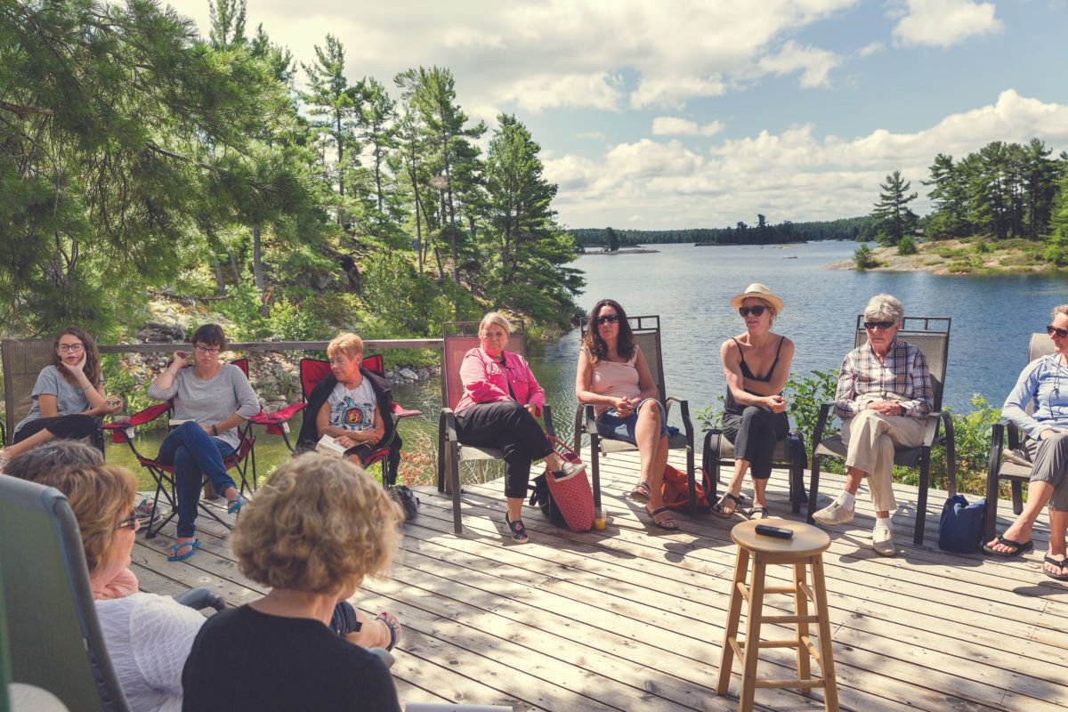 The cottage book club meets on the deck