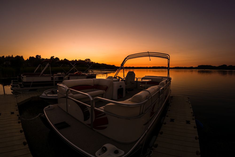 Pontoon boat at sunset