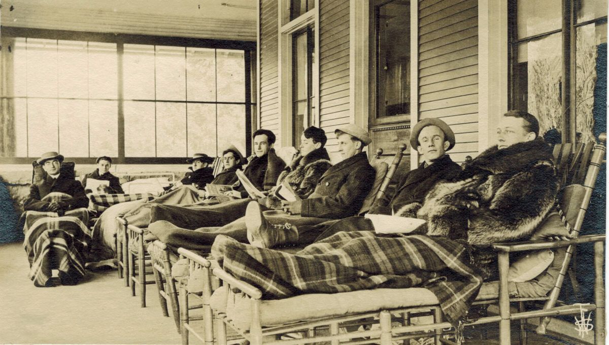 Men on Cure Chairs on Cure Porch