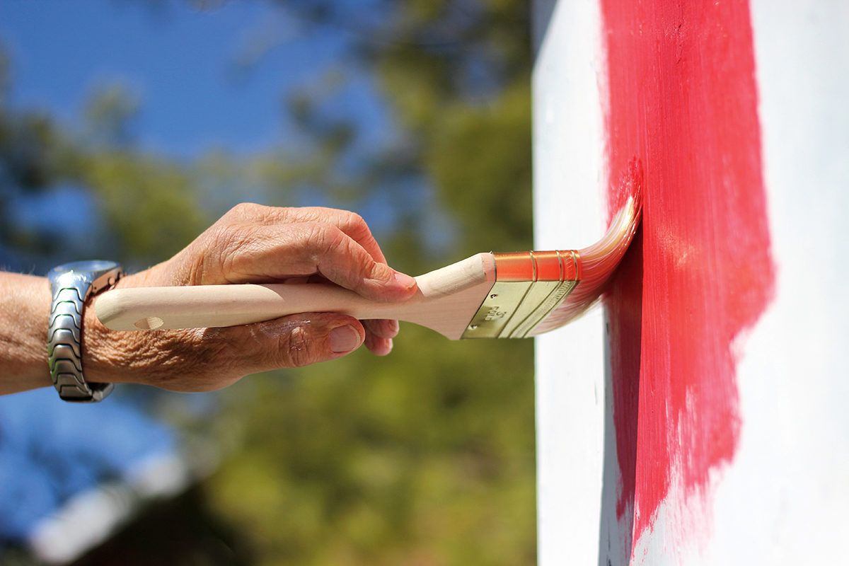 Hand painting an exterior wall