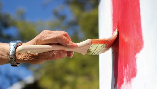Hand painting an exterior wall