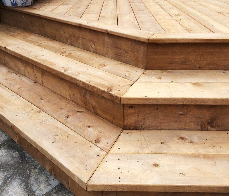 close-up of wraparound stairs on a deck