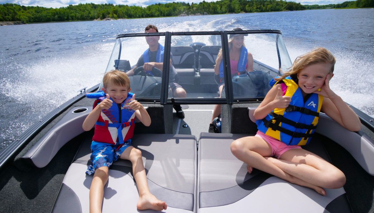 family enjoys a day on the boat