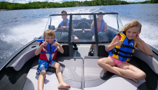 family enjoys a day on the boat