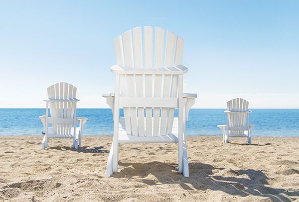three different sized white muskoka chairs sitting on a beach, project