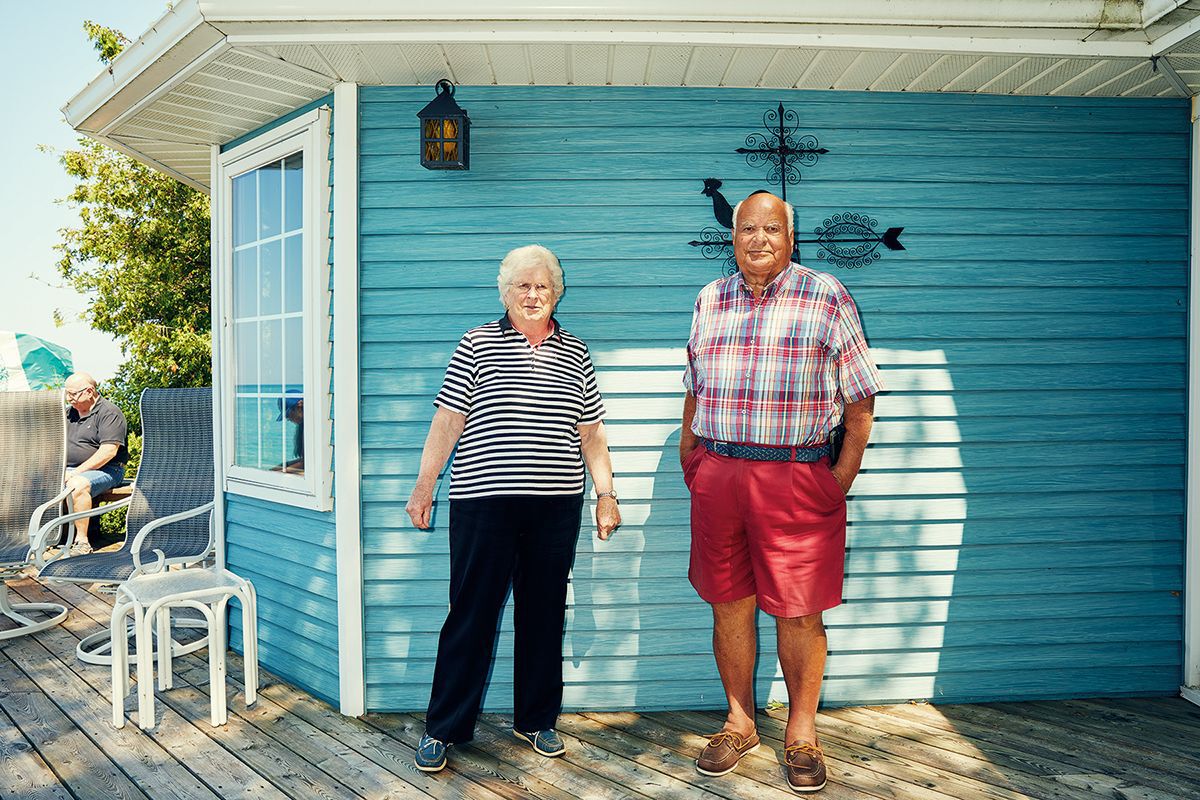 ross and mary lou klopp stand on the deck of their blue cottage a bruce beach