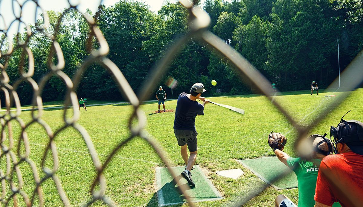 man about to hit a baseball at bruce beach, ont. field with catcher and umpire behind him