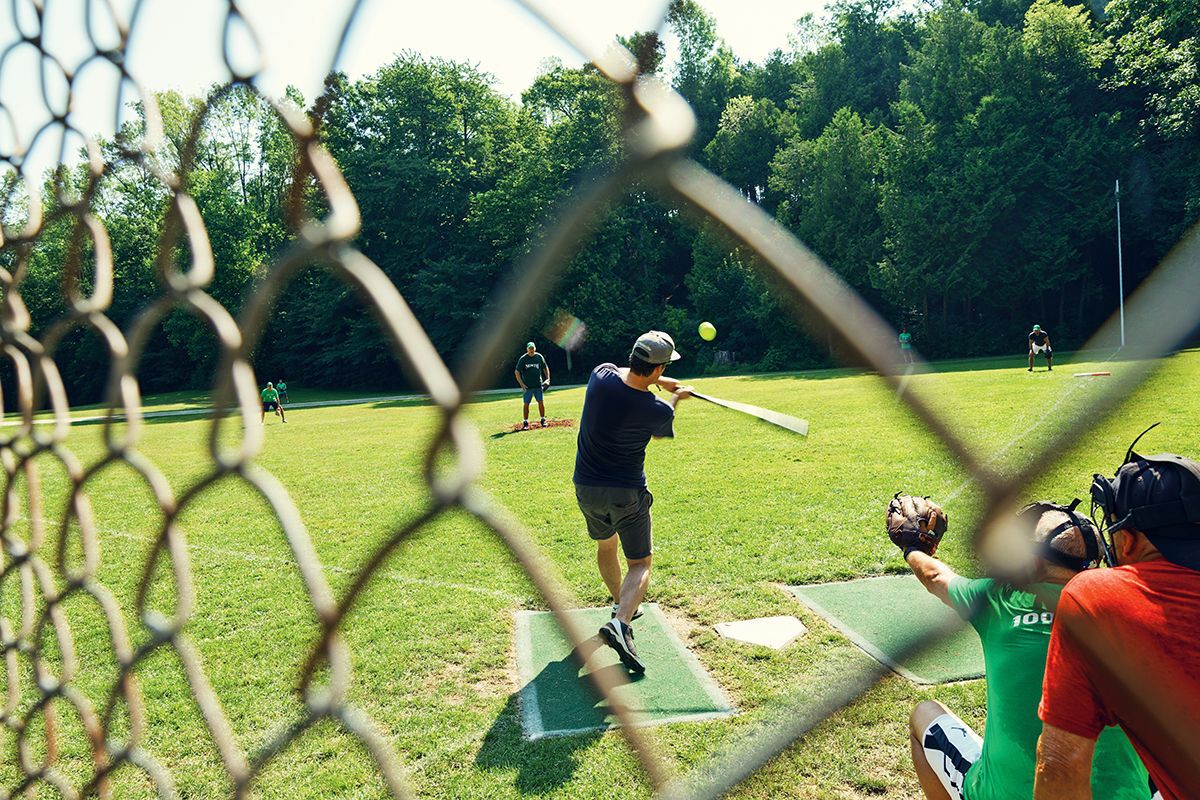 man about to hit a baseball at bruce beach, ont. field with catcher and umpire behind him
