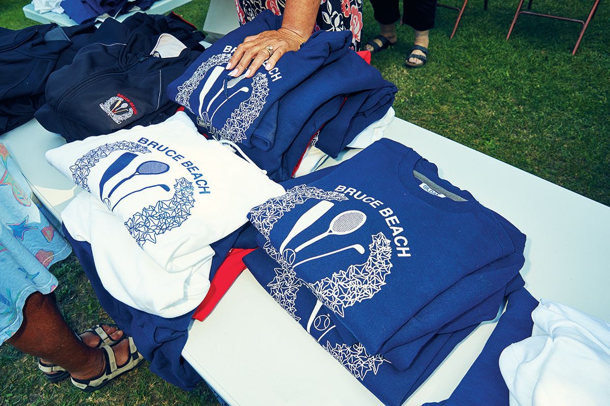bruce beach custom shirts with community logo being sold at the saturday picnic