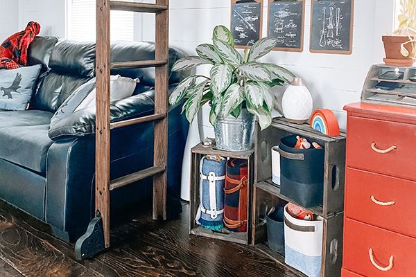 wooden crates used for storage and design holding plaid blankets, family