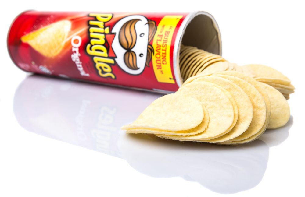 Tube of original pringles on white background, secret spot